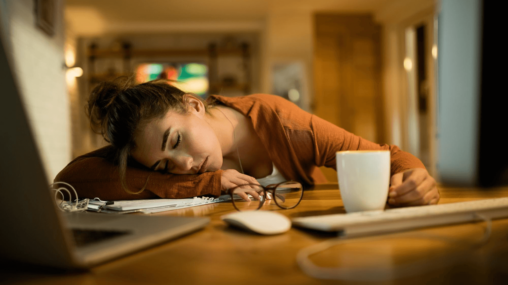 Exhausted person at desk